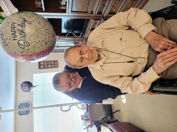 A Caregiver helping their patient celebrate their birthday